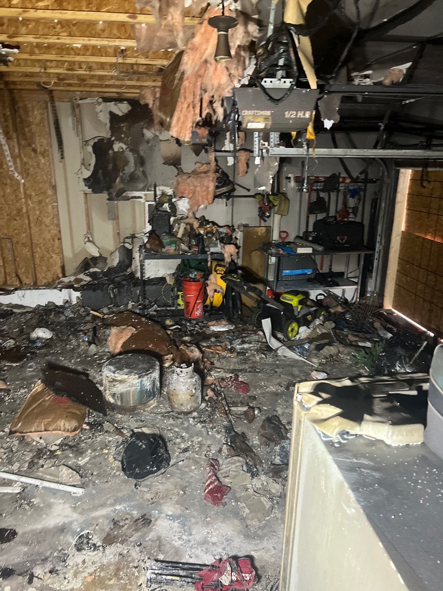 Extensive fire damage inside a Lexington garage cleared by IRS crew