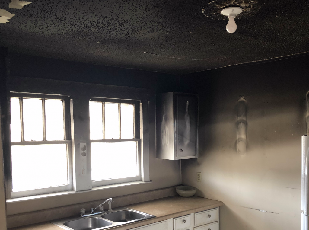 Heavy smoke and soot damage in a Lexington kitchen after a fire